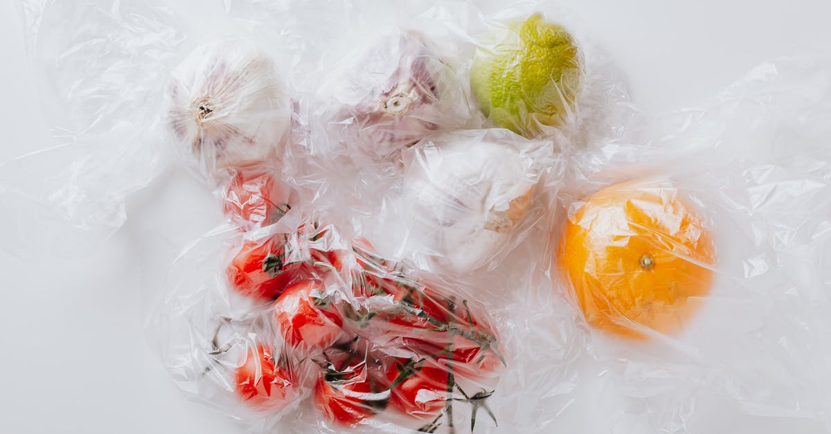 Is there a measurable difference between fresh and dried minced garlic? - From above of bunch of ripe tomatoes put near garlic bulbs and citrus fruits covered with transparent plastic bags on white surface Is there a measurable difference between fresh and dried minced garlic? - From above of bunch of ripe tomatoes put near garlic bulbs and citrus fruits covered with transparent plastic bags on white surface