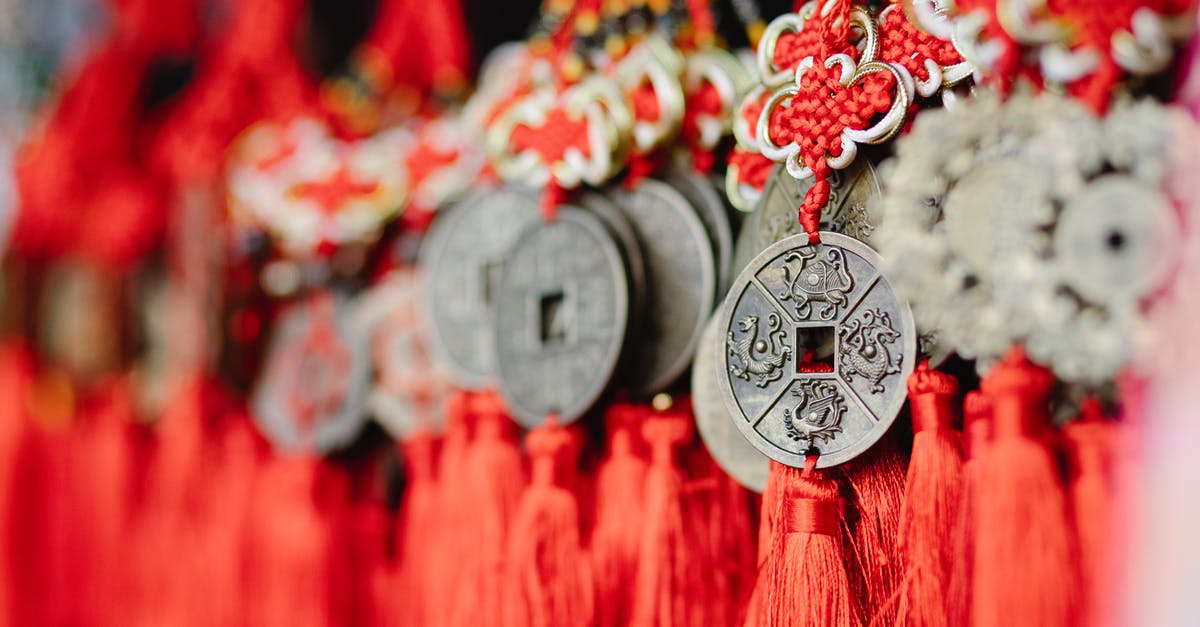 Is there a significant difference between Indian and Chinese star anise? - Collection of assorted round amulets in shape of Chinese coins with red satin threads Is there a significant difference between Indian and Chinese star anise? - Collection of assorted round amulets in shape of Chinese coins with red satin threads