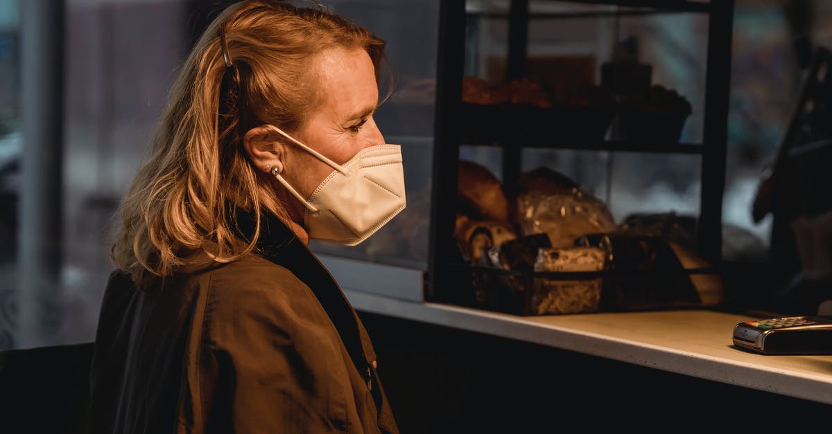 Is there a trick to turn old bread into almost-new bread? - Customer in respiratory mask against bakery counter Is there a trick to turn old bread into almost-new bread? - Customer in respiratory mask against bakery counter