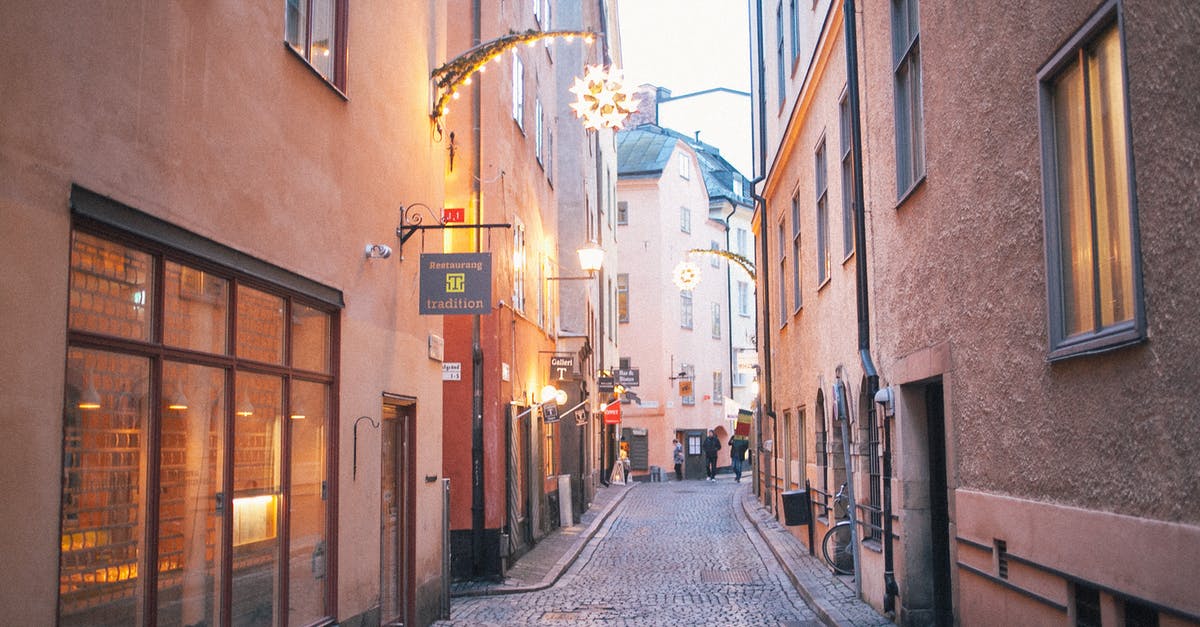 Is there a way to revive an old potato? - Narrow pedestrian street between old residential buildings at twilight Is there a way to revive an old potato? - Narrow pedestrian street between old residential buildings at twilight