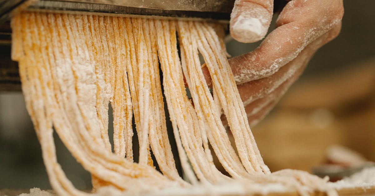 Is there an alternative to spreading flour when rolling the dough? - Person Flattening a Dough With Rolling Pin Is there an alternative to spreading flour when rolling the dough? - Person Flattening a Dough With Rolling Pin
