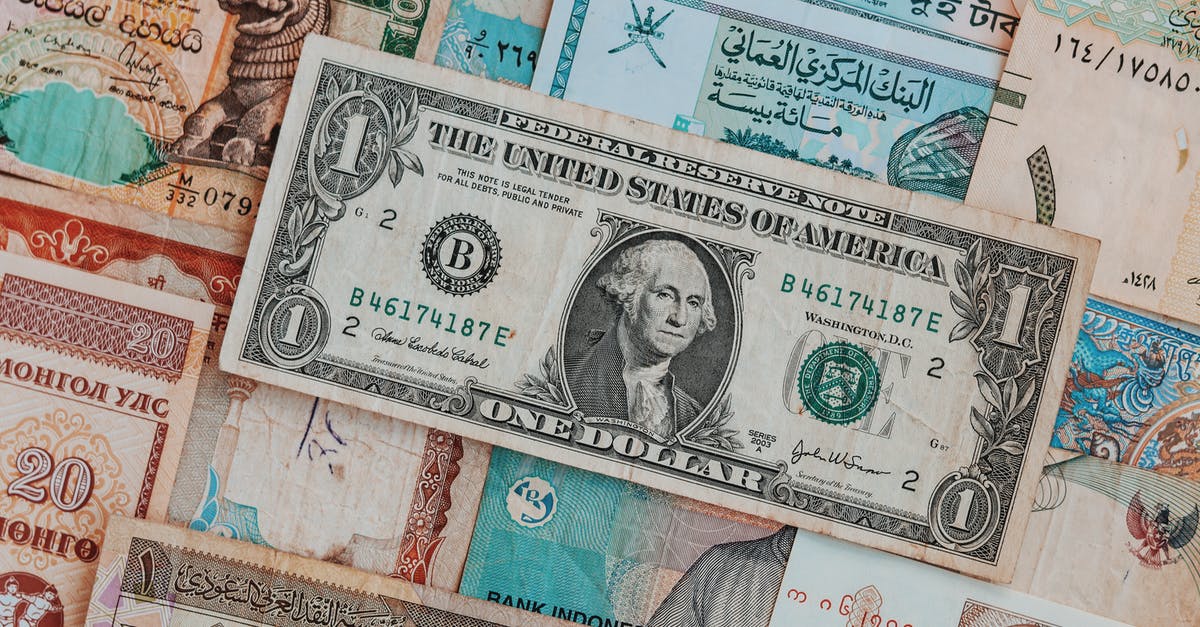 Is there an official comprehensive list of E-numbers? - Collection of banknotes with dollar bill on top