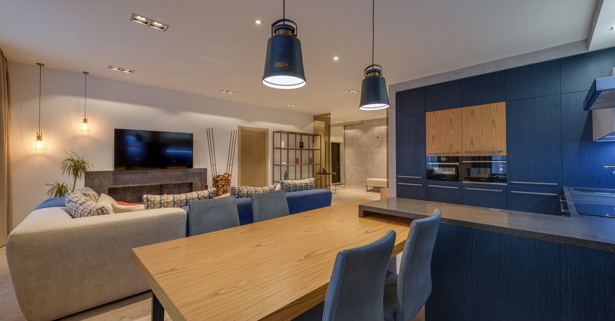 Is there any difference between cheap and expensive vodka? - Interior of modern lounge with kitchen illuminated with lamps in comfortable spacious apartment Is there any difference between cheap and expensive vodka? - Interior of modern lounge with kitchen illuminated with lamps in comfortable spacious apartment