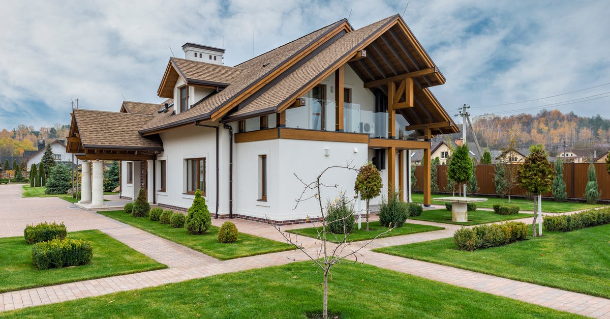 Is there any difference between cheap and expensive vodka? - Exterior of modern cottage house with columns and balcony surrounded by green grass and trees Is there any difference between cheap and expensive vodka? - Exterior of modern cottage house with columns and balcony surrounded by green grass and trees