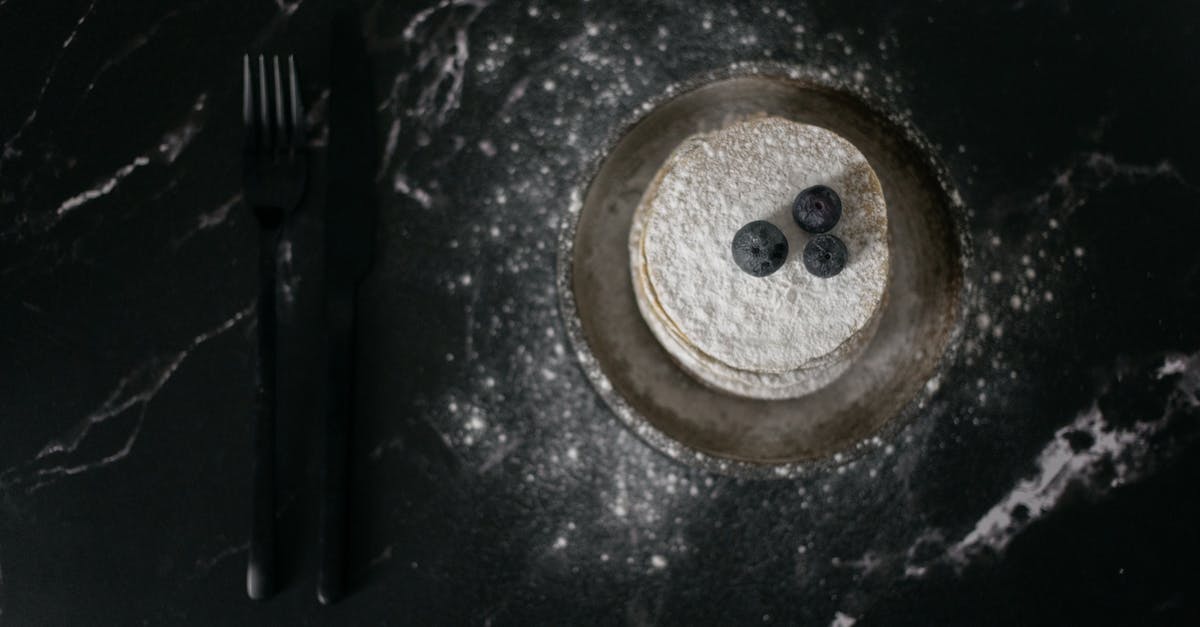 Is there any way to make an egg pancake without sugar or white flour? [closed] - Pancakes decorated with blueberries near fork and knife