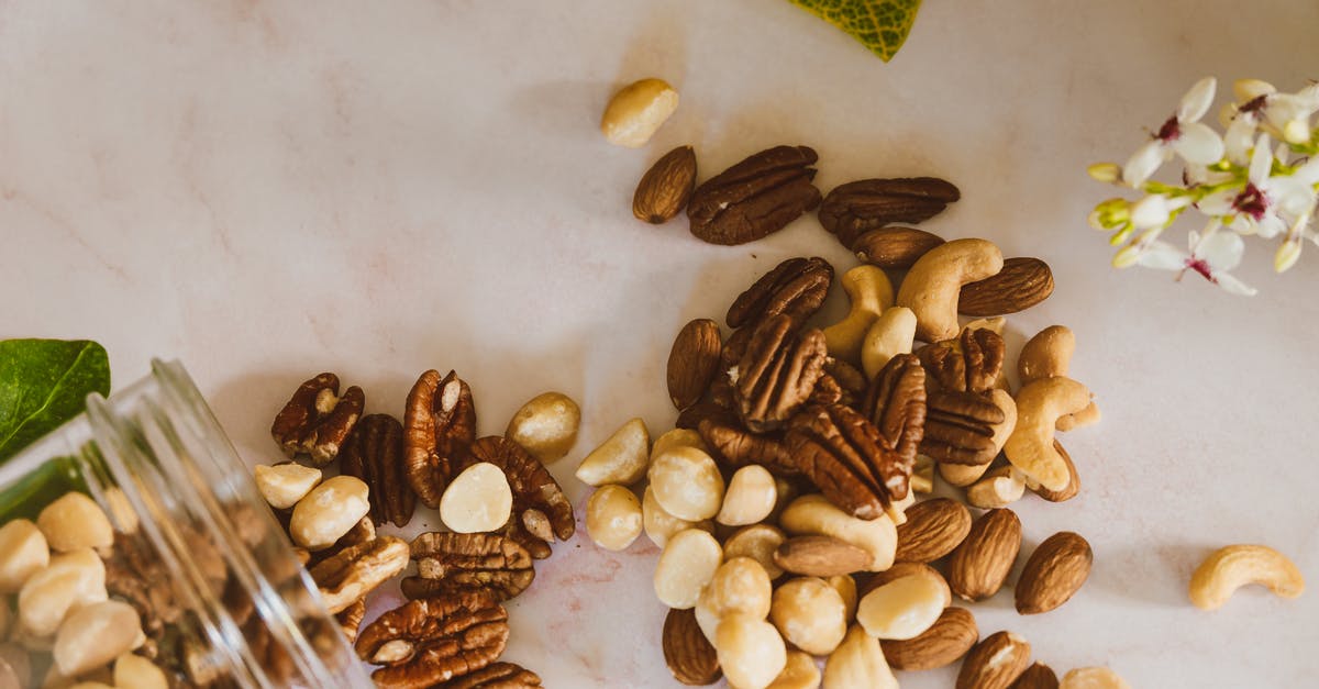 Is there any way to "Salt" unsalted cashew pieces? - Brown Almond Nuts on White Table Is there any way to "Salt" unsalted cashew pieces? - Brown Almond Nuts on White Table