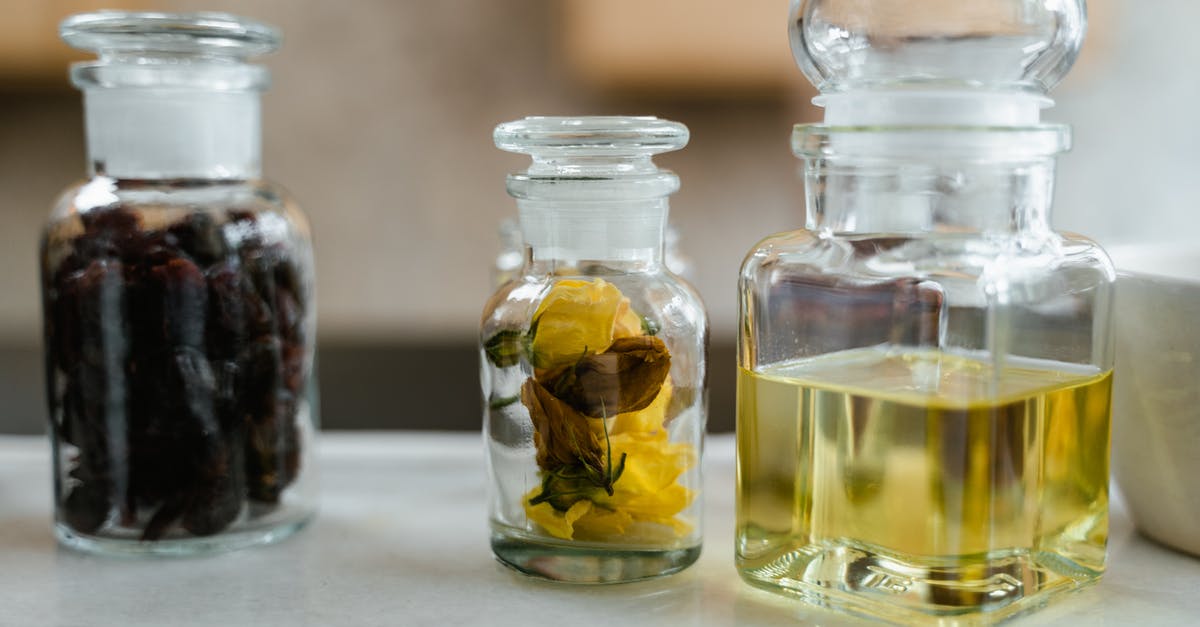 Is there anything wrong with keeping oil, salt, and vinegar together? [duplicate] - Clear Glass Bottles With Yellow Liquid