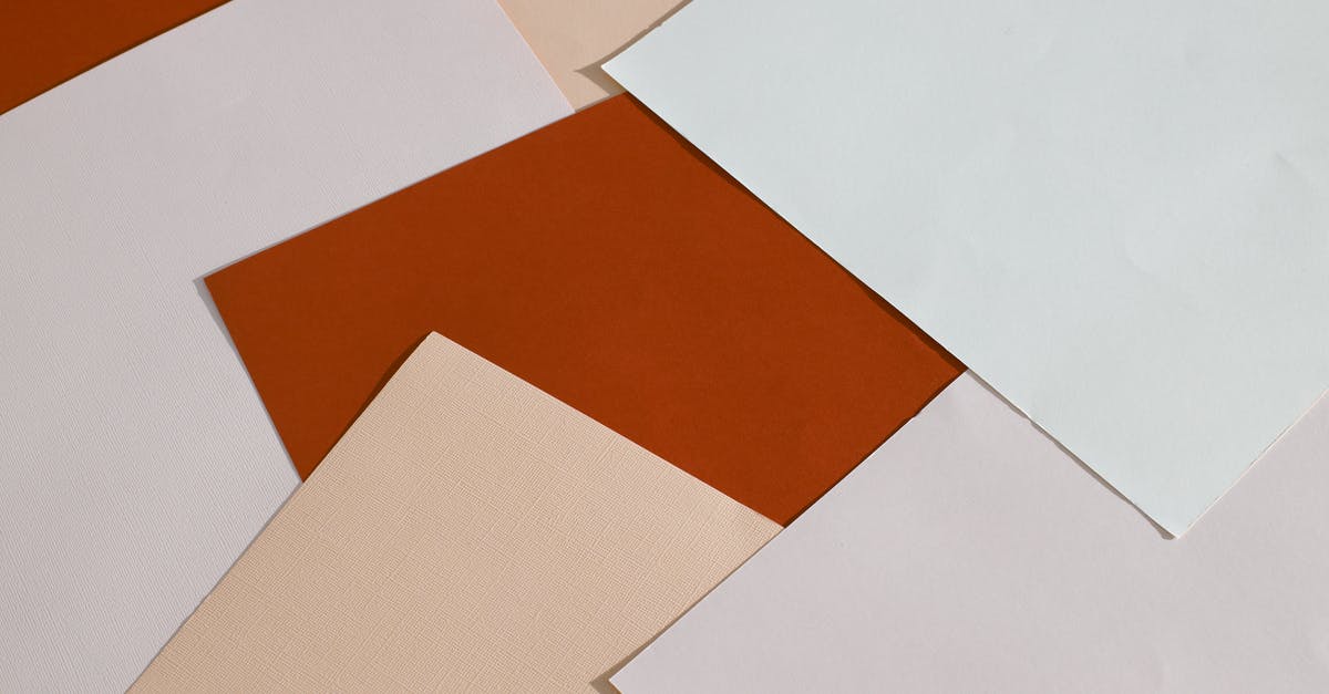 Is there pattern to stack lasagna? - From above of blank paper sheets of different colors scattered on table as abstract background Is there pattern to stack lasagna? - From above of blank paper sheets of different colors scattered on table as abstract background
