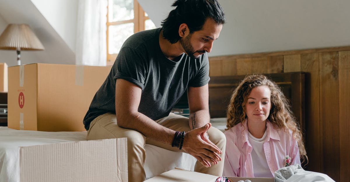Is there such a thing as 'onion hair'? - Content adult ethnic man and woman in casual clothes sitting together in attic bedroom of new apartment among cardboard packages while unpacking stuff Is there such a thing as 'onion hair'? - Content adult ethnic man and woman in casual clothes sitting together in attic bedroom of new apartment among cardboard packages while unpacking stuff
