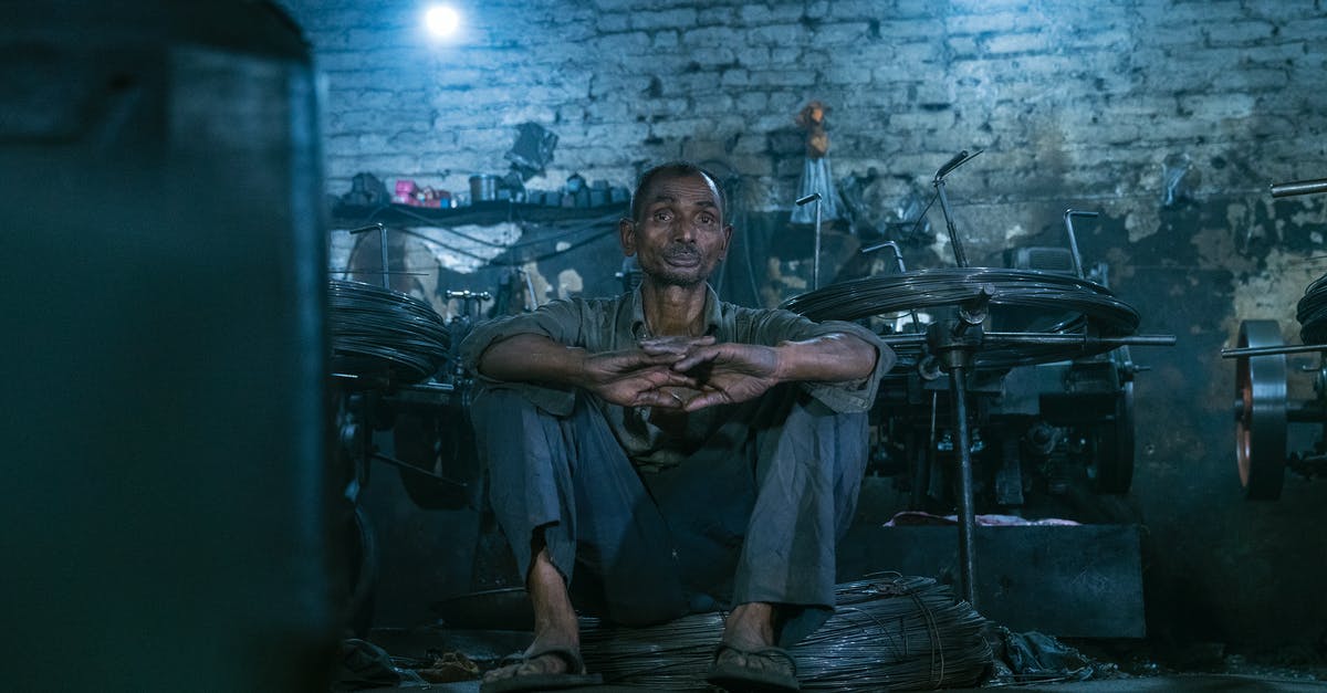 Is there such a thing as unsteamed rolled oats? - Man in Brown T-shirt Sitting on Floor