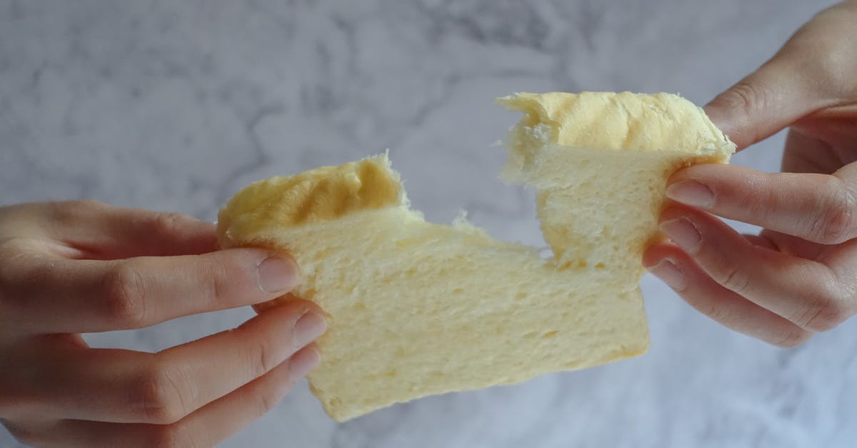Is there such thing as white wheat berries? - Person Holding Slice of Loaf Bread