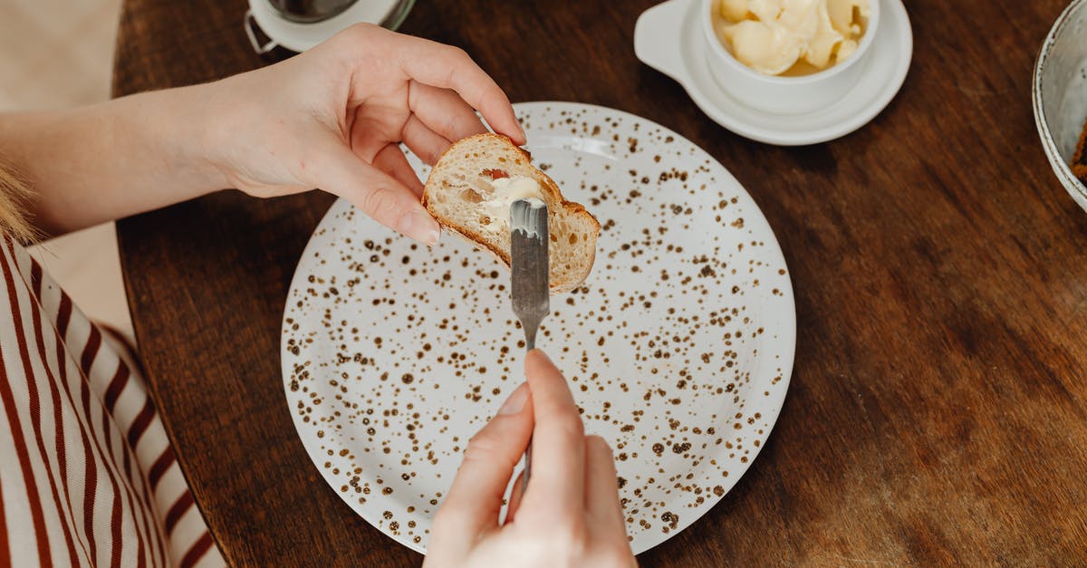 Is this butter ok to eat? - A Person Spreading Butter on a Bread Is this butter ok to eat? - A Person Spreading Butter on a Bread