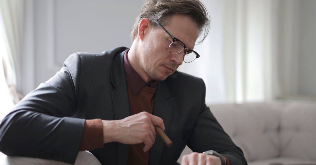 Is time a factor in Caramelization? - Photo of Man in Black Suit Sitting on White Couch Smoking a Cigar While Looking at the Time Is time a factor in Caramelization? - Photo of Man in Black Suit Sitting on White Couch Smoking a Cigar While Looking at the Time