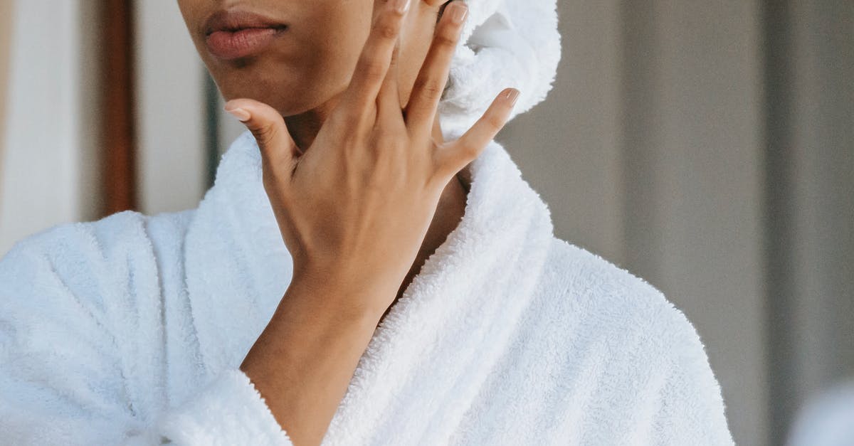 Is unsour sour cream too new or too old? - Crop anonymous female in white bathrobe with towel on head applying facial moisturizing cream on face while standing in bathroom Is unsour sour cream too new or too old? - Crop anonymous female in white bathrobe with towel on head applying facial moisturizing cream on face while standing in bathroom