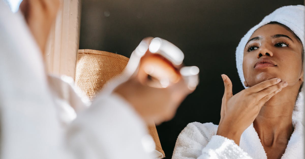 Is unsour sour cream too new or too old? - African American young female in white bathrobe applying moisturizing cream on face while standing in bathroom Is unsour sour cream too new or too old? - African American young female in white bathrobe applying moisturizing cream on face while standing in bathroom