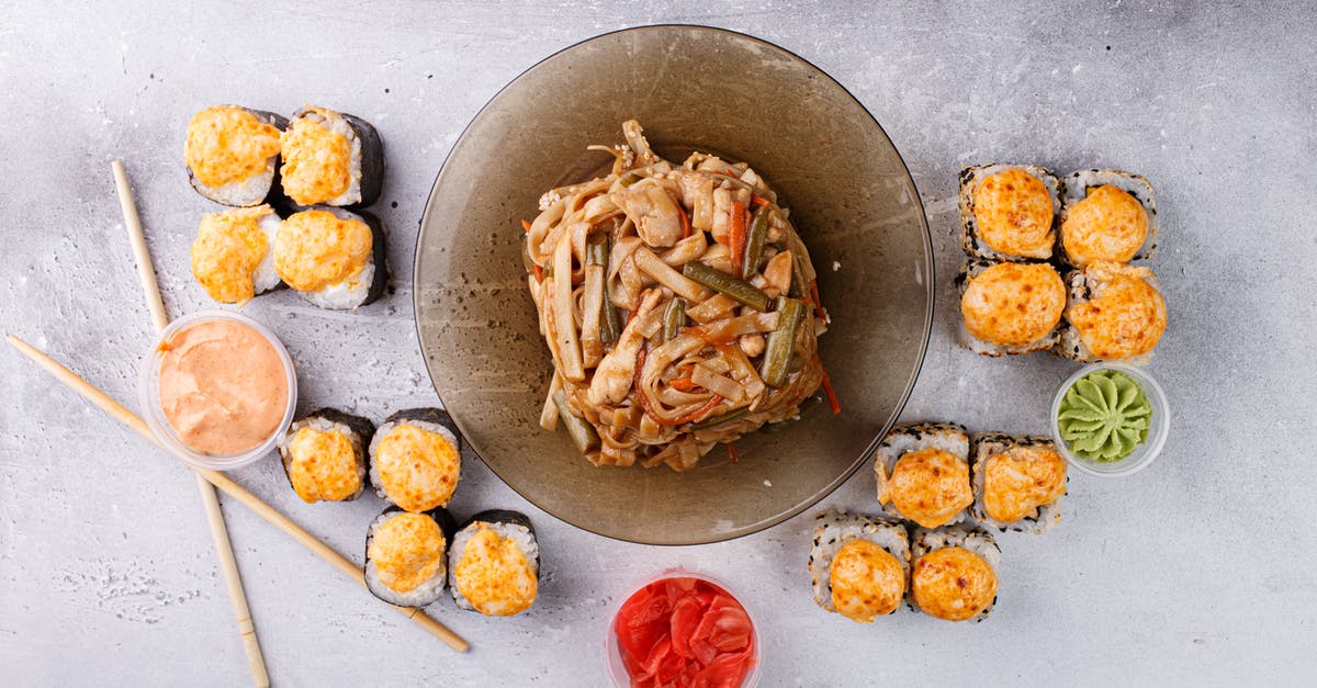 Is wasabi considered to be spicy or to be a spice? - Appetizing Asian noodle and sushi rolls arranged on gray table Is wasabi considered to be spicy or to be a spice? - Appetizing Asian noodle and sushi rolls arranged on gray table