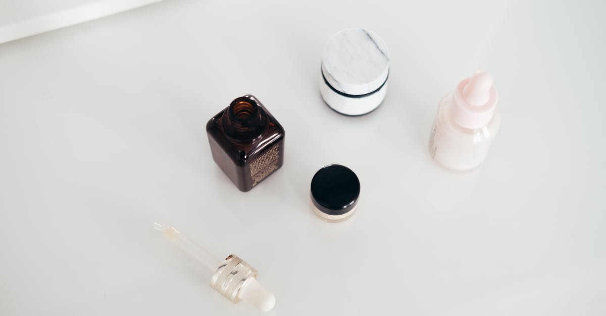 Isi cream whipper head valve sticks open - Set of natural cosmetic products on table Isi cream whipper head valve sticks open - Set of natural cosmetic products on table