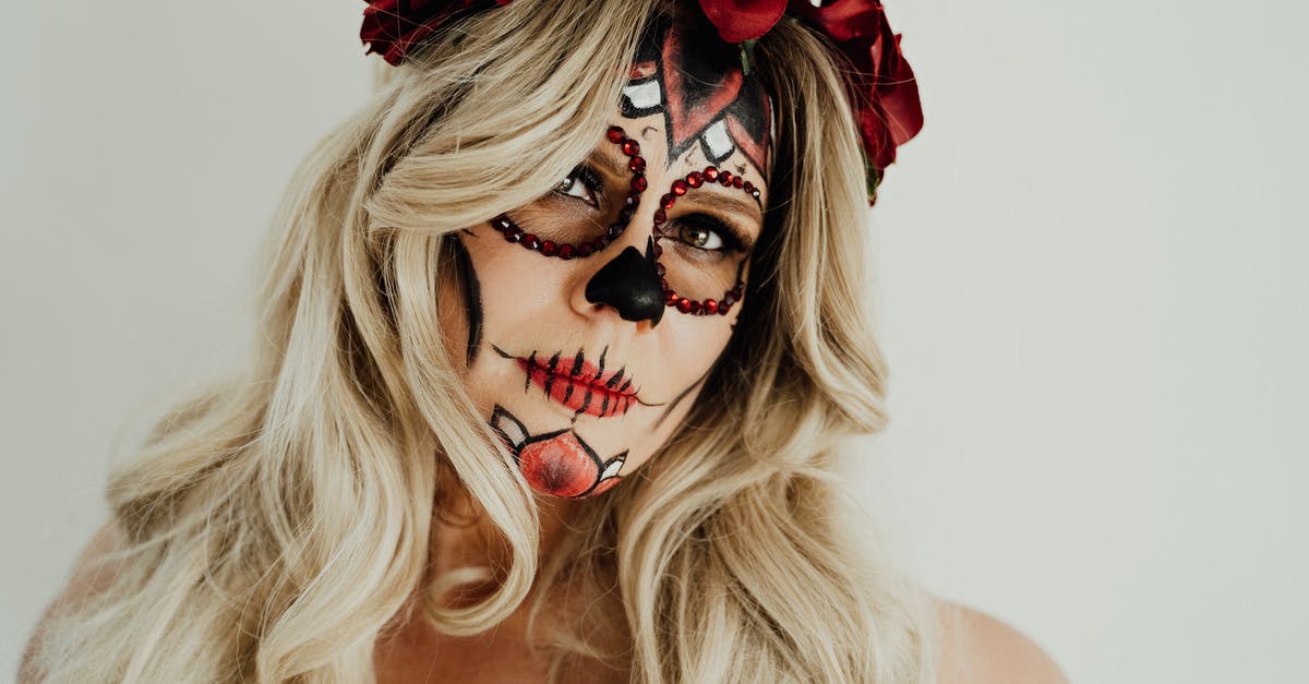 issues with mexican restaurant-style white cheesedip - Stylish young female model with sugar skull makeup in white studio issues with mexican restaurant-style white cheesedip - Stylish young female model with sugar skull makeup in white studio