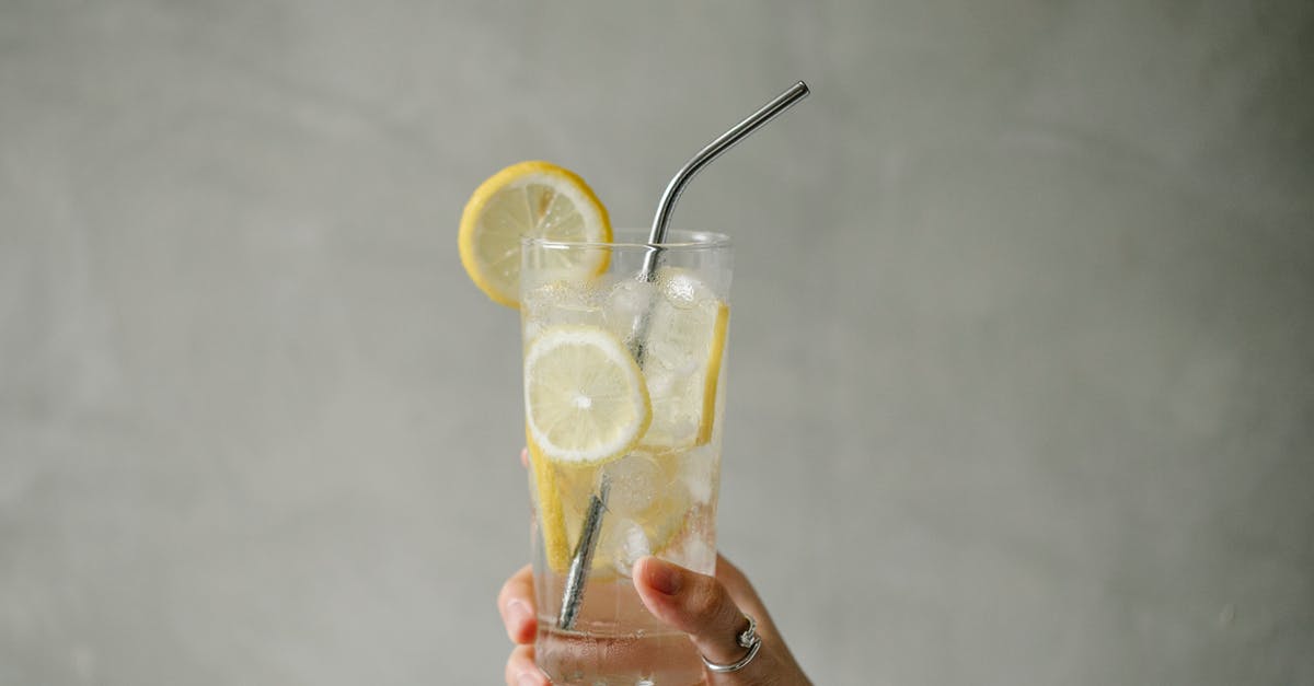 Items in freezer, including ice cubes, taste freezer burnt. Possible causes? - Crop woman with glass of lemonade Items in freezer, including ice cubes, taste freezer burnt. Possible causes? - Crop woman with glass of lemonade