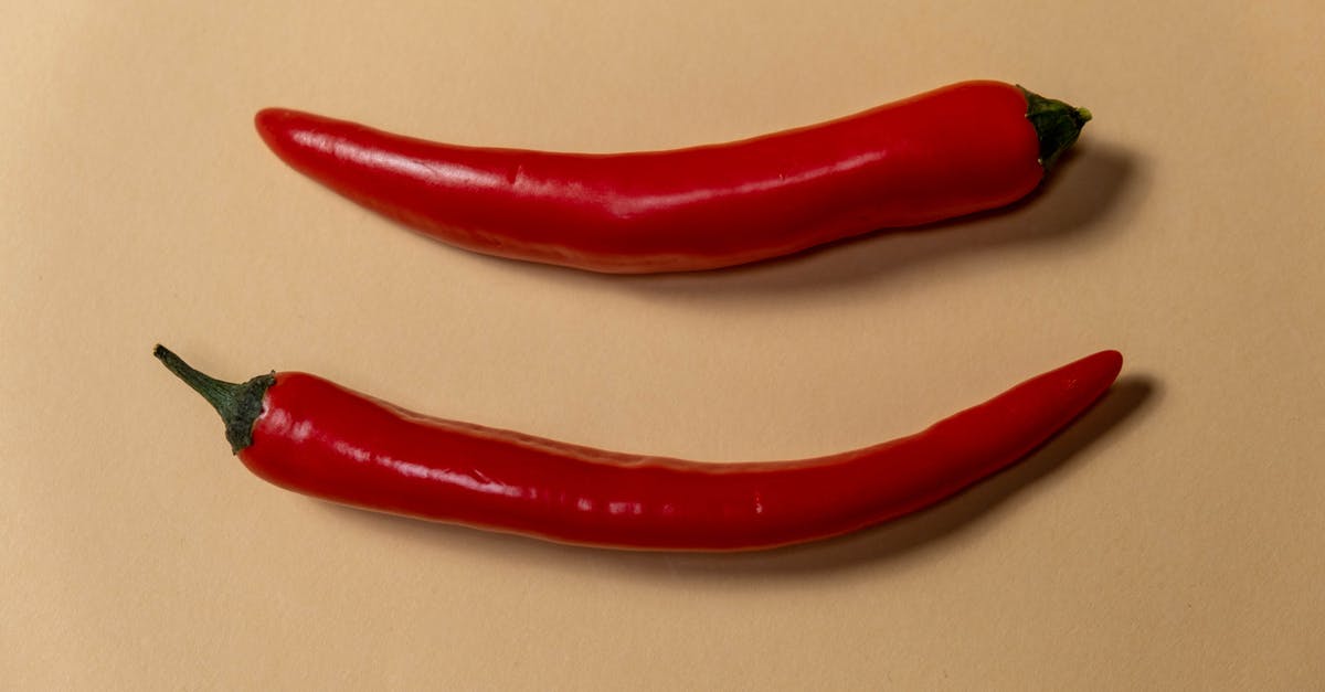 Jalapeno condiment for pho - Red Chili on White Table Jalapeno condiment for pho - Red Chili on White Table