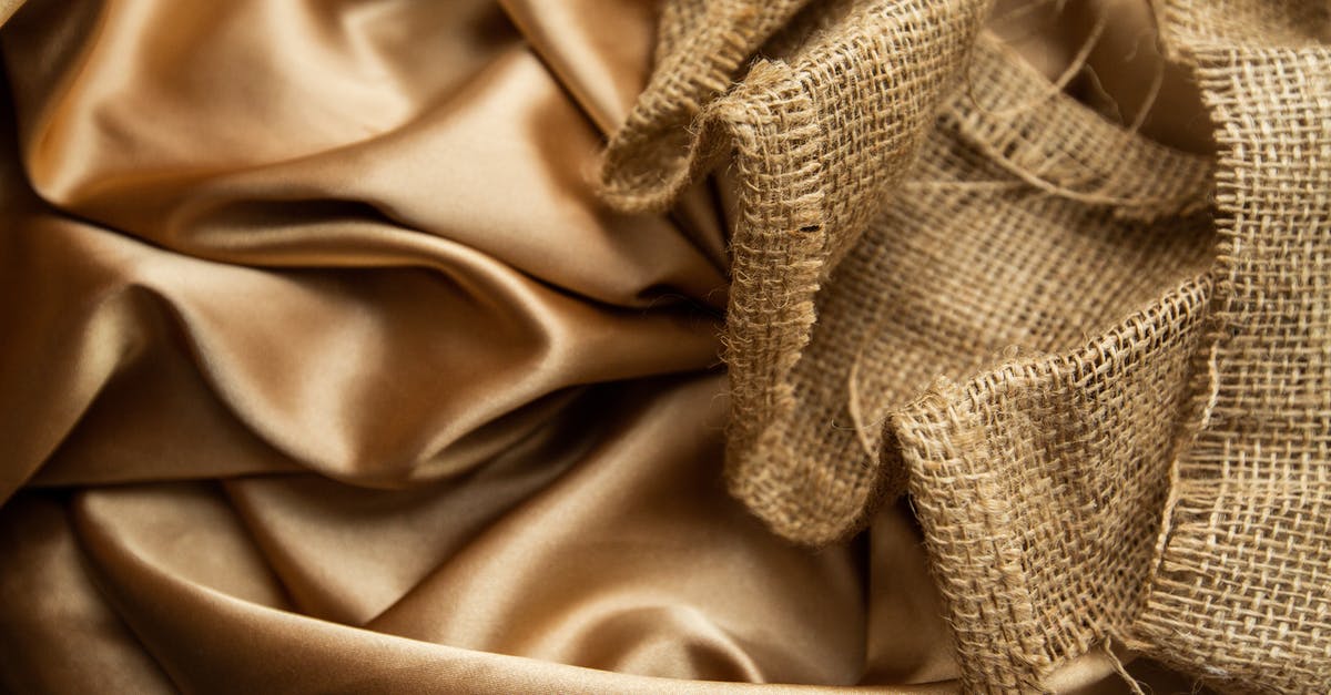 Jason's Deli has two different kinds of soft serve, what's the difference? [closed] - Top view draped golden satin fabric and mesh rattan cane webbing placed on table as background