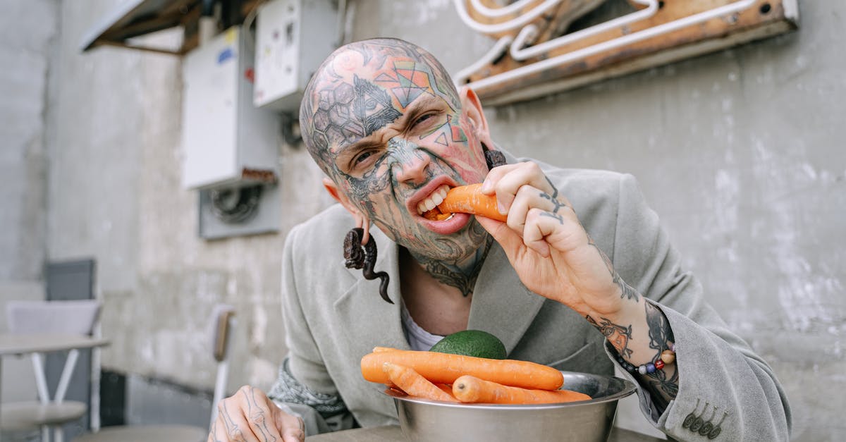 Jerk vegetable? - Person in Gray Long Sleeve Shirt Holding Brown and White Ceramic Bowl With Sliced Orange Fruit Jerk vegetable? - Person in Gray Long Sleeve Shirt Holding Brown and White Ceramic Bowl With Sliced Orange Fruit