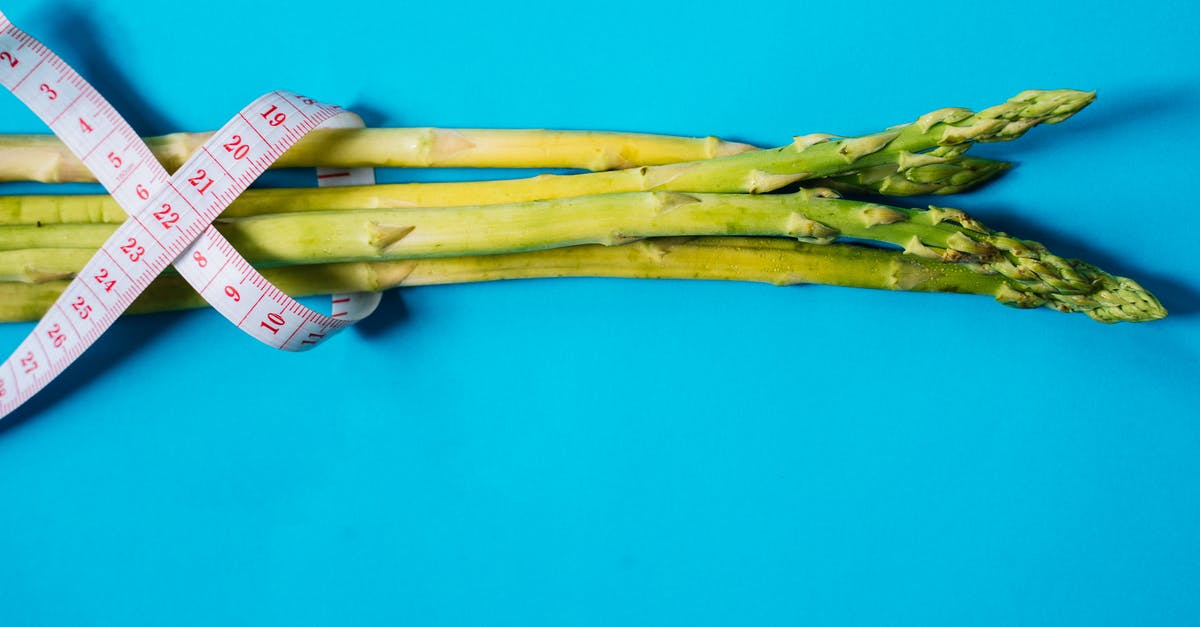 Jerk vegetable? - Brown Wooden Stick on Blue Surface Jerk vegetable? - Brown Wooden Stick on Blue Surface