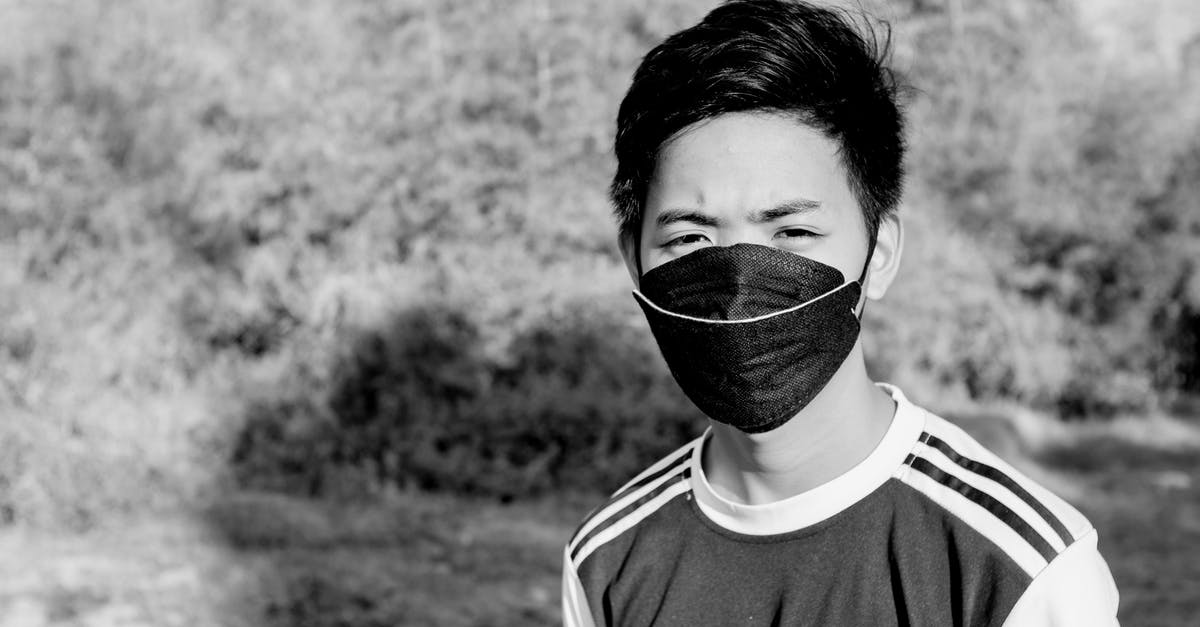 Jicama moldy on the outside but white inside, is this safe to eat? - Serious Asian male in medical mask standing in nature Jicama moldy on the outside but white inside, is this safe to eat? - Serious Asian male in medical mask standing in nature