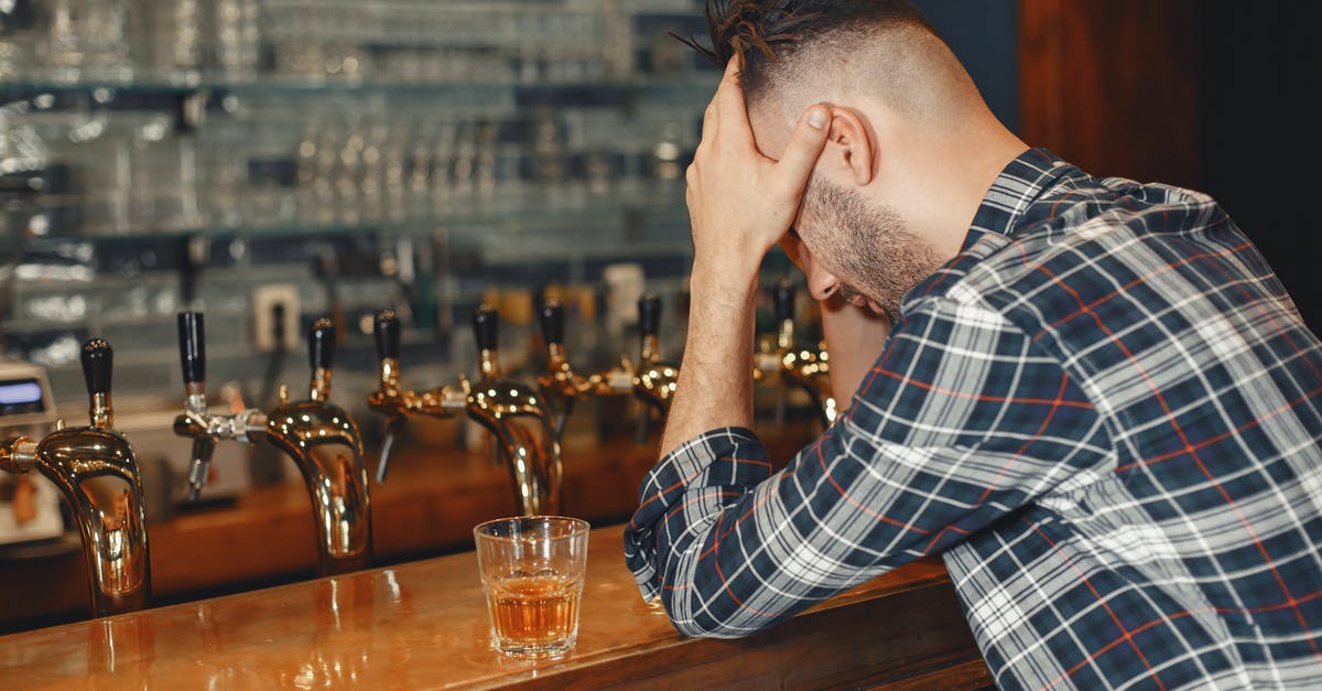 Kefir sensitivity to drinking tap water? - Man in Blue Dress Shirt Sitting Beside Bar Counter Kefir sensitivity to drinking tap water? - Man in Blue Dress Shirt Sitting Beside Bar Counter