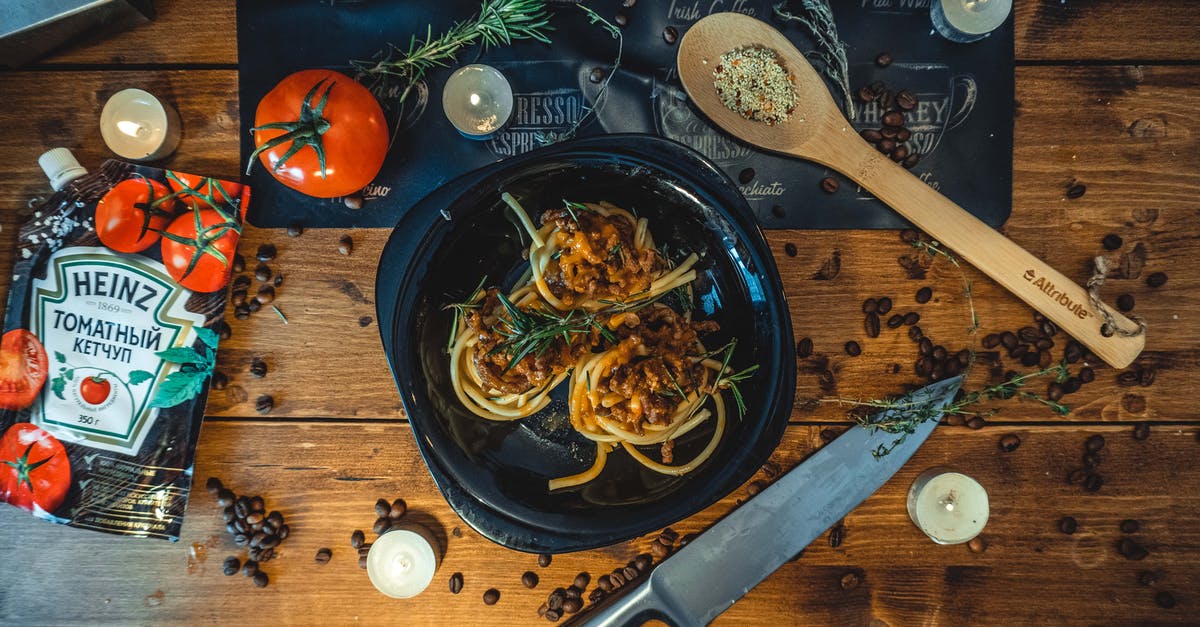 Key ingredients for classic Sauce Bolognese (Ragù Bolognese)? - Pasta Dish on Ceramic Plate Key ingredients for classic Sauce Bolognese (Ragù Bolognese)? - Pasta Dish on Ceramic Plate