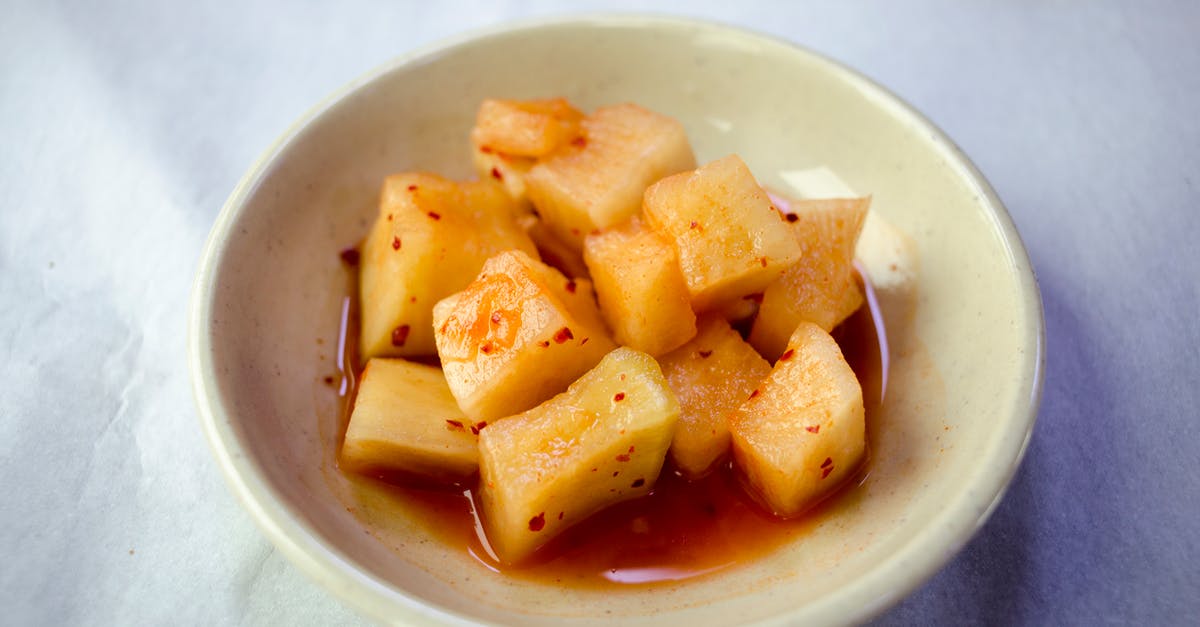 Kimchi juice to aid lactic fermentation of half-sour pickles - Pickled Radish in a Bowl