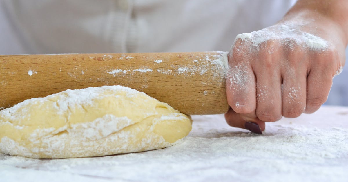 Kneading before or after rising? - Person Holding Dough With White Powder Kneading before or after rising? - Person Holding Dough With White Powder