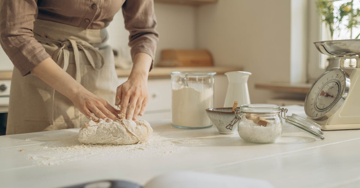 Kneading dough - significance of warm hands - Person in Brown Long Sleeve Shirt Holding a Dough Kneading dough - significance of warm hands - Person in Brown Long Sleeve Shirt Holding a Dough