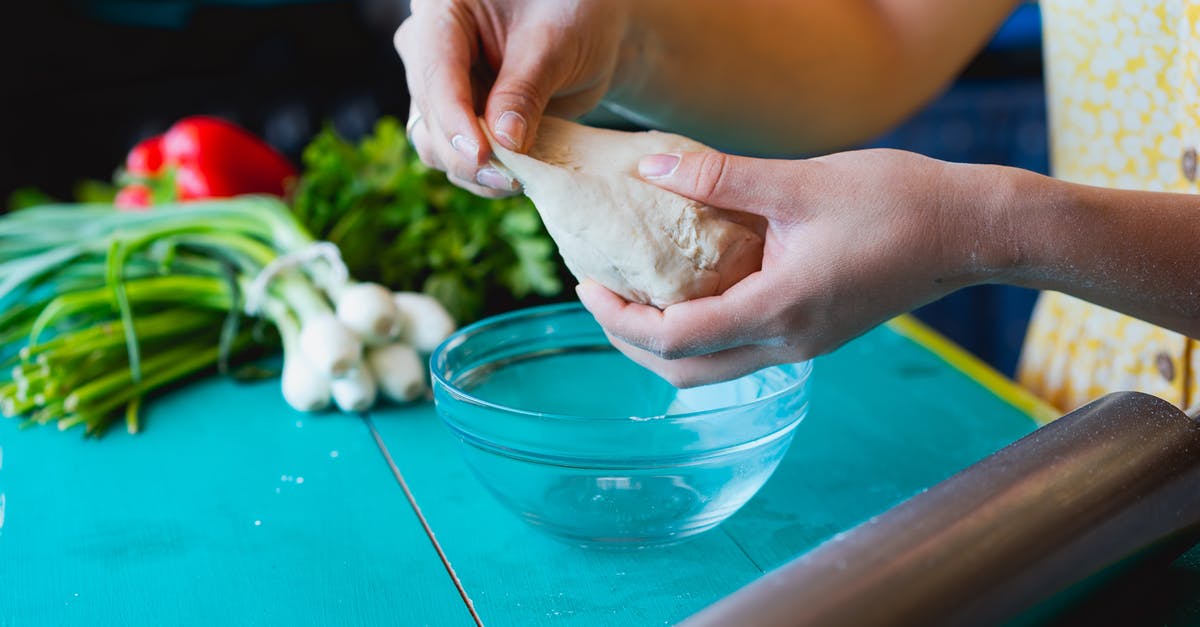 Kneading dough - significance of warm hands - A Person Holding a Dough Kneading dough - significance of warm hands - A Person Holding a Dough