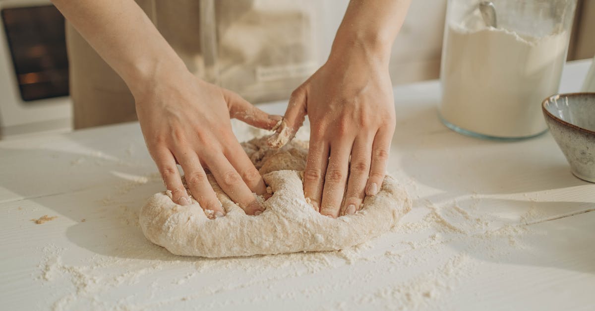 Kneading dough - significance of warm hands - A Person Kneading a Dough on the Table Kneading dough - significance of warm hands - A Person Kneading a Dough on the Table