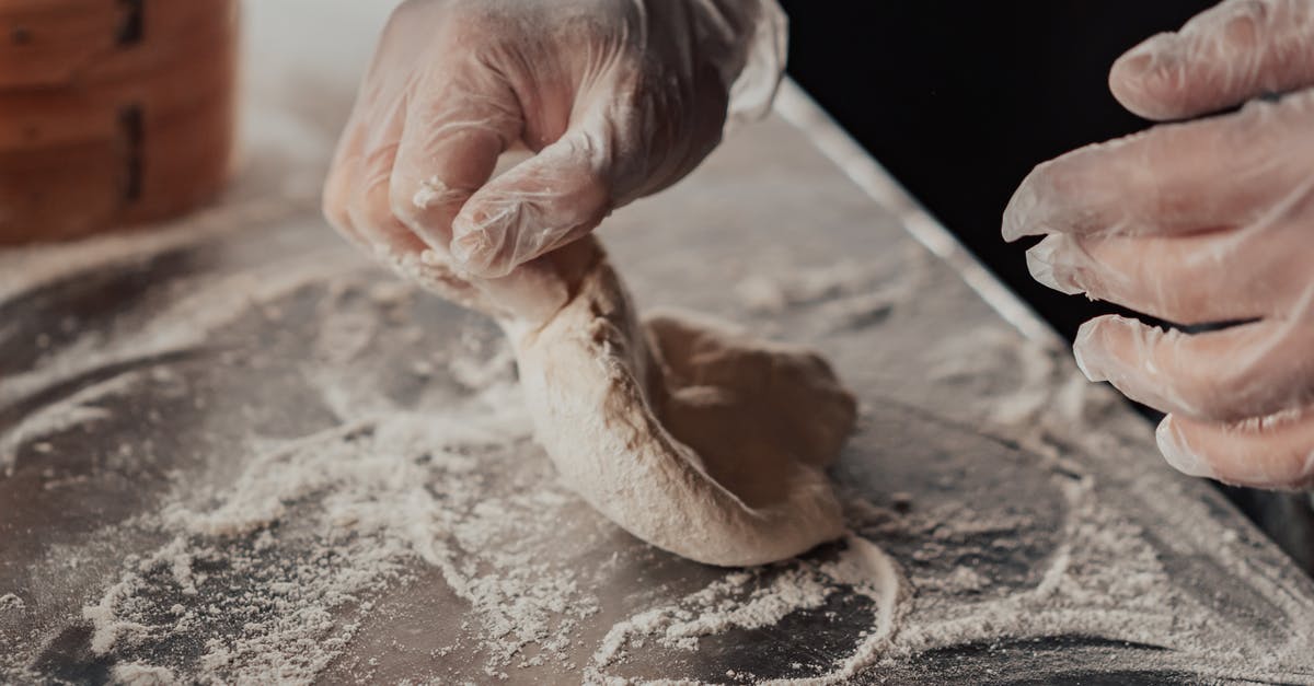 Kneading dough with long nails; latex gloves? - A Person Kneading a Dough Kneading dough with long nails; latex gloves? - A Person Kneading a Dough