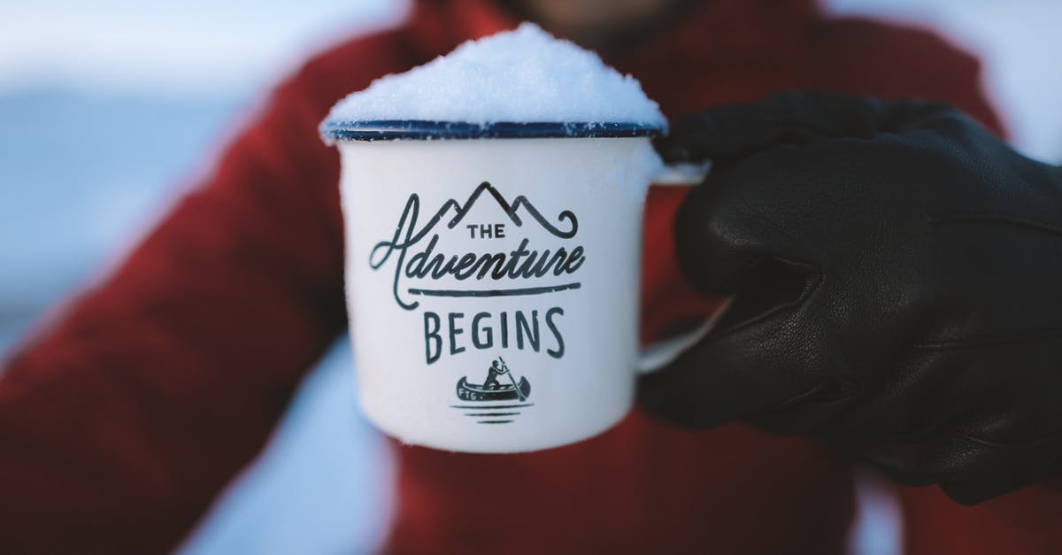 Le Creuset vs. Lodge Enamel - Selective Focus Photography of Person Holding the Adventure Begins Mug Le Creuset vs. Lodge Enamel - Selective Focus Photography of Person Holding the Adventure Begins Mug