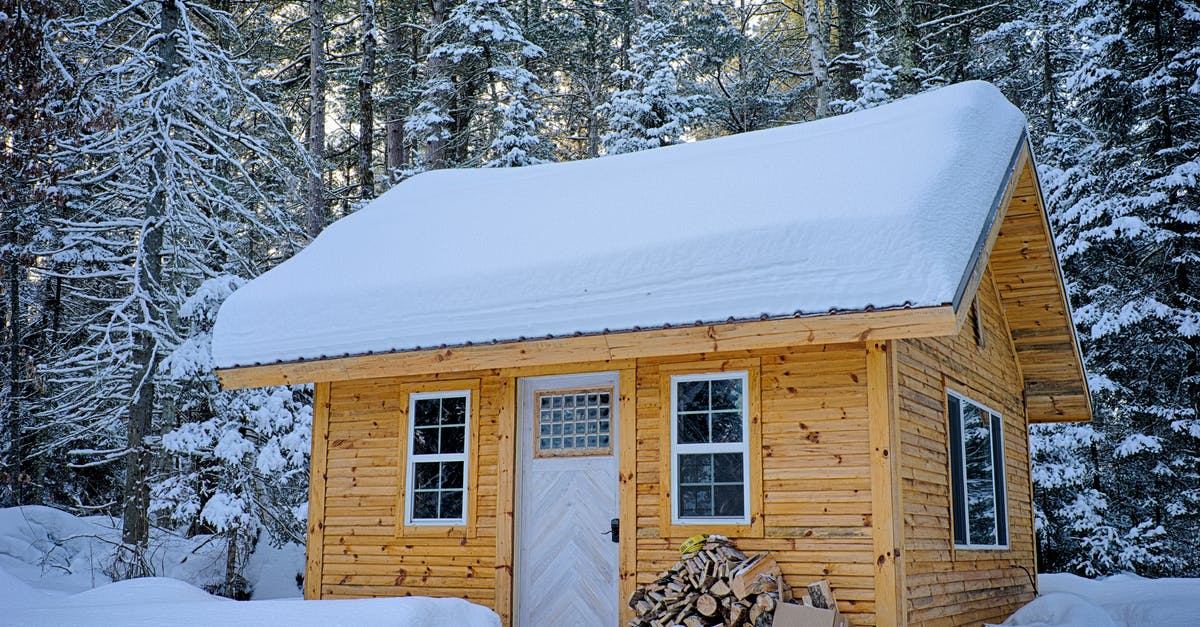 Le Creuset vs. Lodge Enamel - Snow Covered Wooden House Inside Forest Le Creuset vs. Lodge Enamel - Snow Covered Wooden House Inside Forest