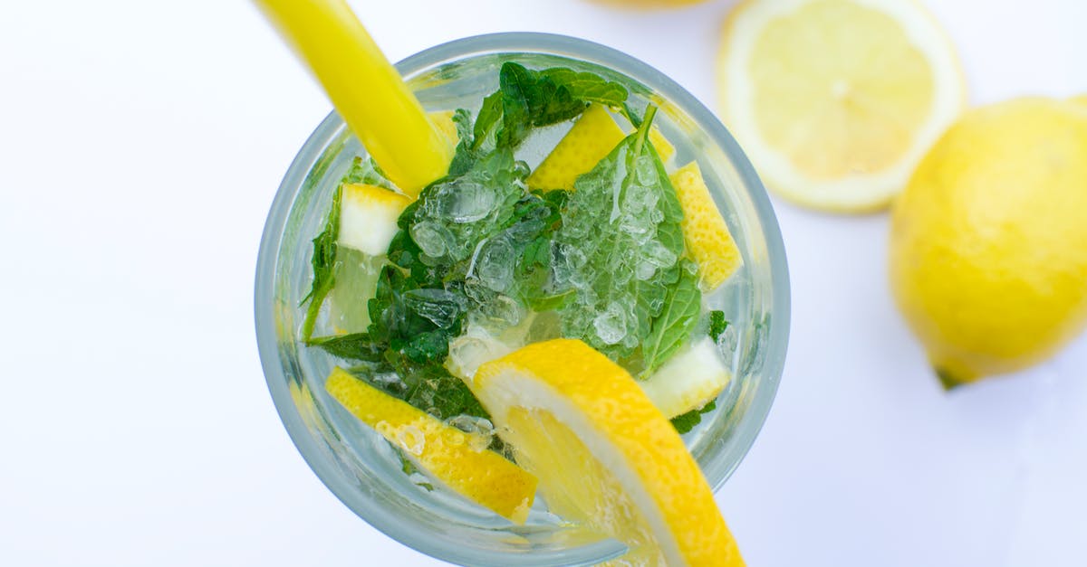 Lemon and Mint drink - Flat Lay Photograph of Highball Glass With Sliced Lemon Lemon and Mint drink - Flat Lay Photograph of Highball Glass With Sliced Lemon