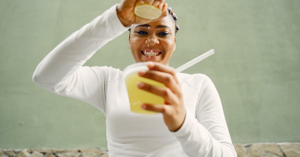 lemon juice curdling white chocolate - A Woman Squeezing a Lemon Into a Plastic Cup lemon juice curdling white chocolate - A Woman Squeezing a Lemon Into a Plastic Cup