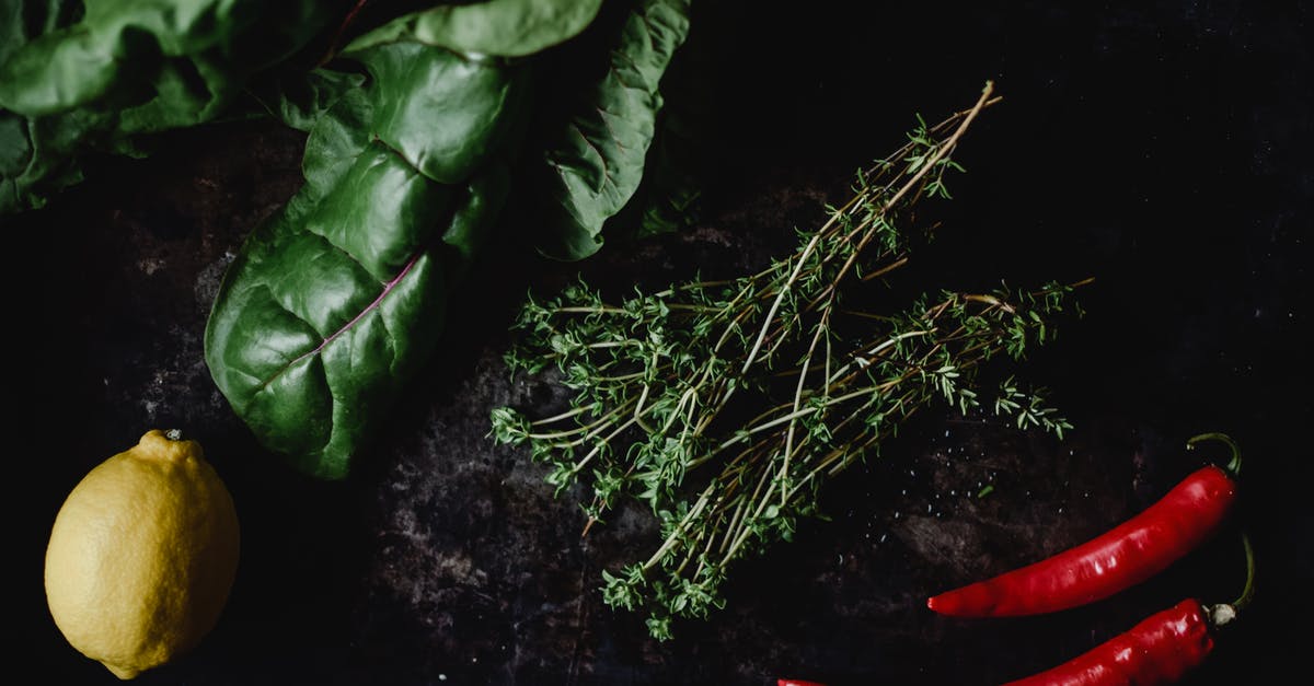 Lemon Thyme Substitute - Overhead Shot of Ingredients on a Black Surface Lemon Thyme Substitute - Overhead Shot of Ingredients on a Black Surface