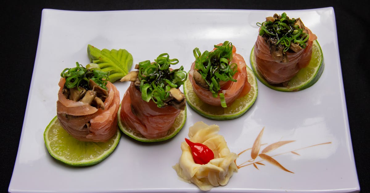 Lime on Fish tastes Bitter - A Healthy Food On A Ceramic Plate Lime on Fish tastes Bitter - A Healthy Food On A Ceramic Plate