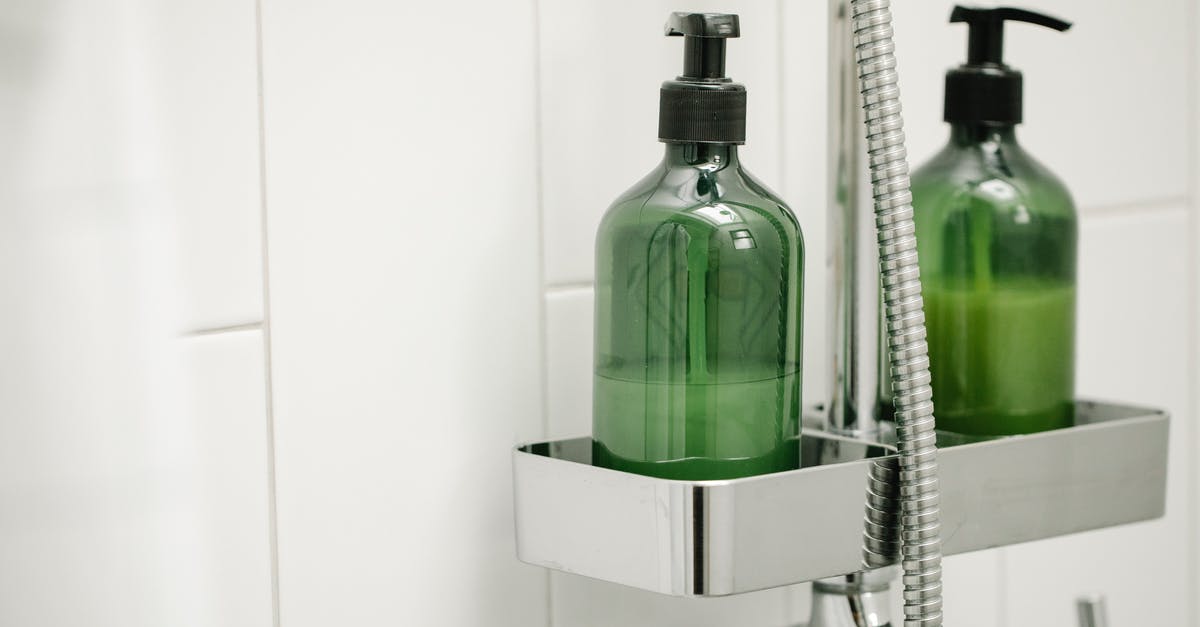 Liquid Pockets in Cream Cheese - Green dispensers on shelf on shower system Liquid Pockets in Cream Cheese - Green dispensers on shelf on shower system