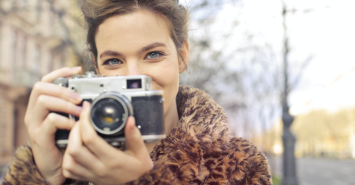 Looking for a way to make a cone shaped cookie - Woman Holding Black and Gray Camera Focus Photo Looking for a way to make a cone shaped cookie - Woman Holding Black and Gray Camera Focus Photo