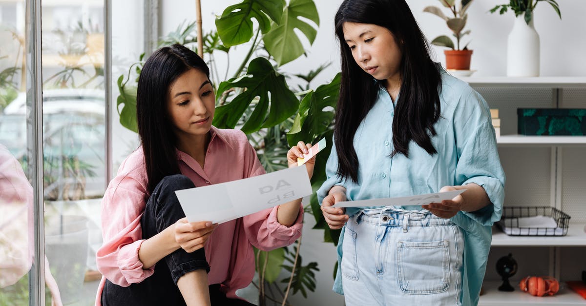 looking for edible paper - 2 Women Holding White Printer Paper looking for edible paper - 2 Women Holding White Printer Paper