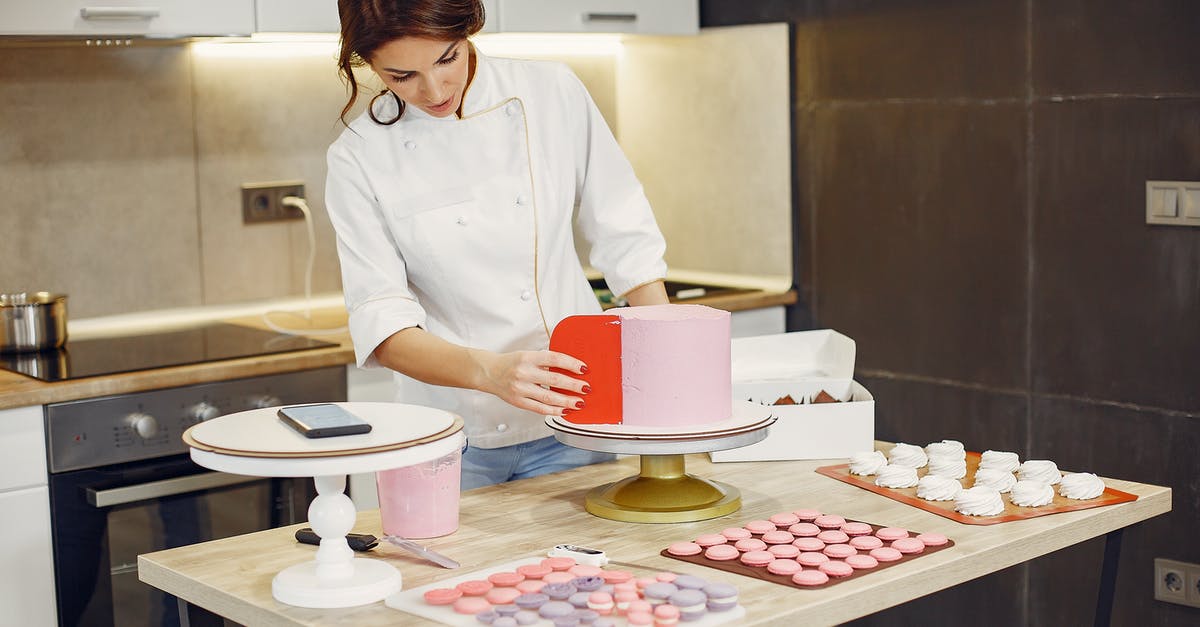 Looking for meat ingredient suggestions for a Yoghurt Cake recipe - Focused female pastry chef preparing cake and desserts with smartphone aside in modern kitchen Looking for meat ingredient suggestions for a Yoghurt Cake recipe - Focused female pastry chef preparing cake and desserts with smartphone aside in modern kitchen