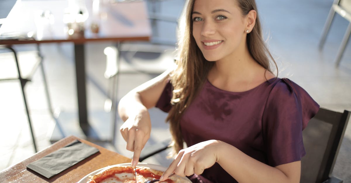 Looking for the name of a Peruvian dish - Woman in Purple Top Eating Pizza Looking for the name of a Peruvian dish - Woman in Purple Top Eating Pizza