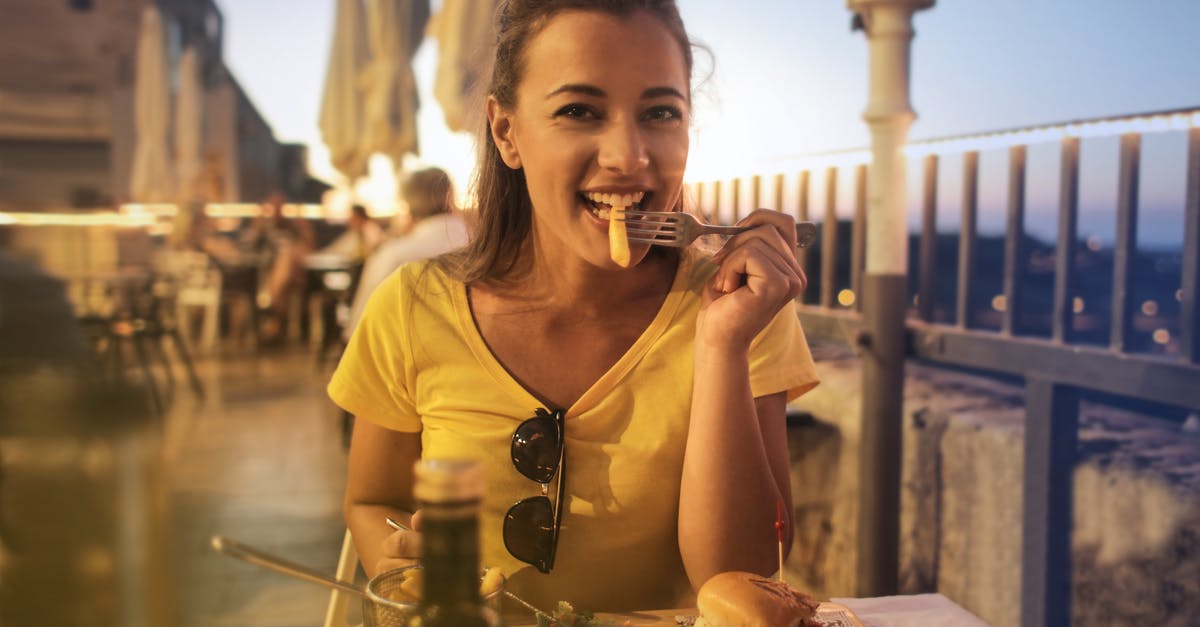 Looking for the name of a Peruvian dish - Woman in Yellow Crew Neck T-shirt Eating Burger Looking for the name of a Peruvian dish - Woman in Yellow Crew Neck T-shirt Eating Burger