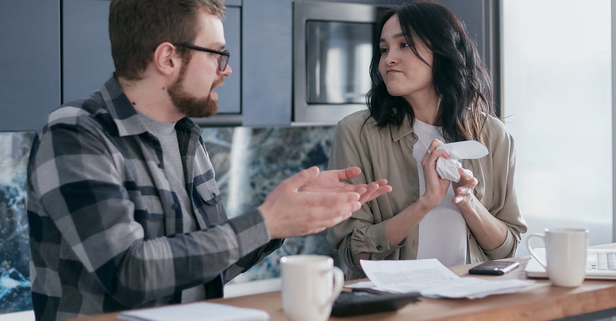 Looking to bake side dishes, having problems with dryness - A Woman Looking at Her Partner while Crumpling a Paper Looking to bake side dishes, having problems with dryness - A Woman Looking at Her Partner while Crumpling a Paper
