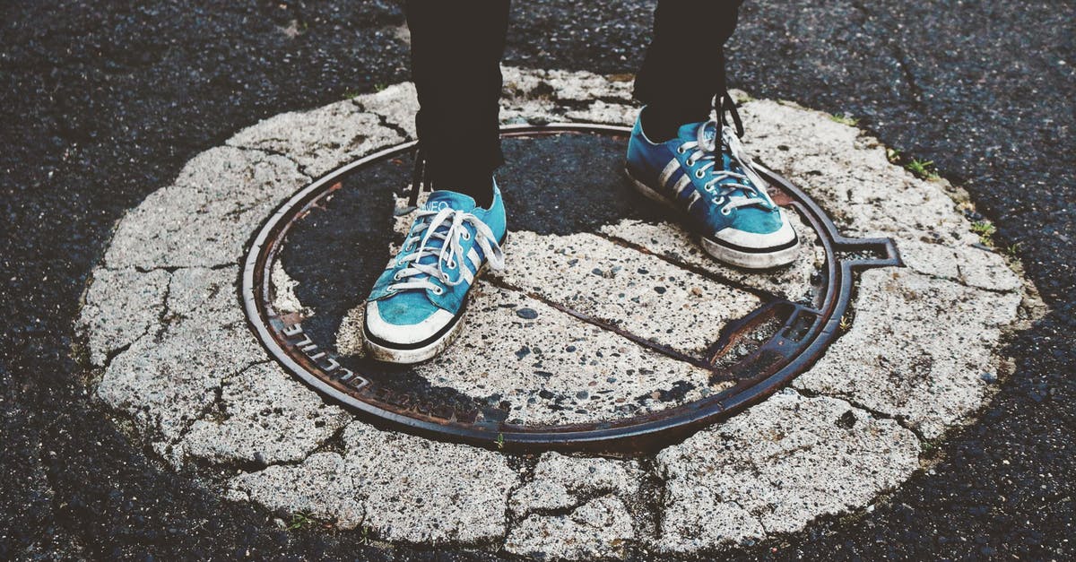 Macarons are wrinkled, cracked and have no feet - Person Standing on Manhole Cover Macarons are wrinkled, cracked and have no feet - Person Standing on Manhole Cover